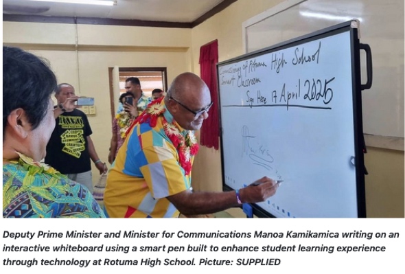 Deputy Prime Minister writes on smart whiteboard